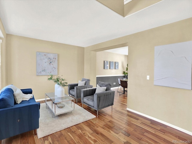 living area featuring wood finished floors and baseboards