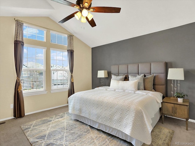 carpeted bedroom with multiple windows, lofted ceiling, baseboards, and ceiling fan