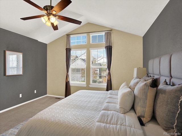 bedroom with carpet, vaulted ceiling, baseboards, and ceiling fan