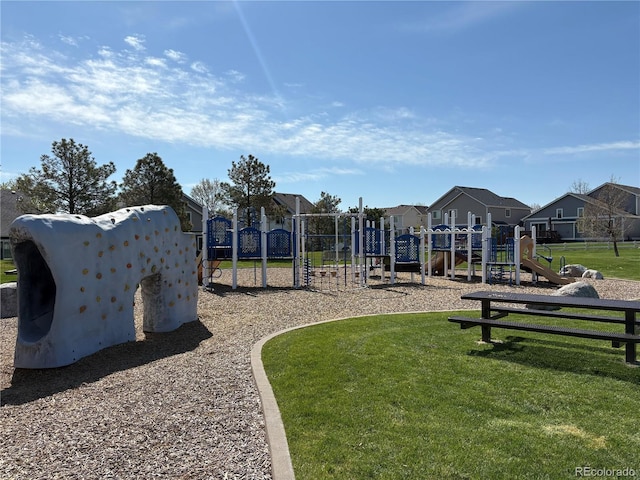 community playground with a yard and a residential view