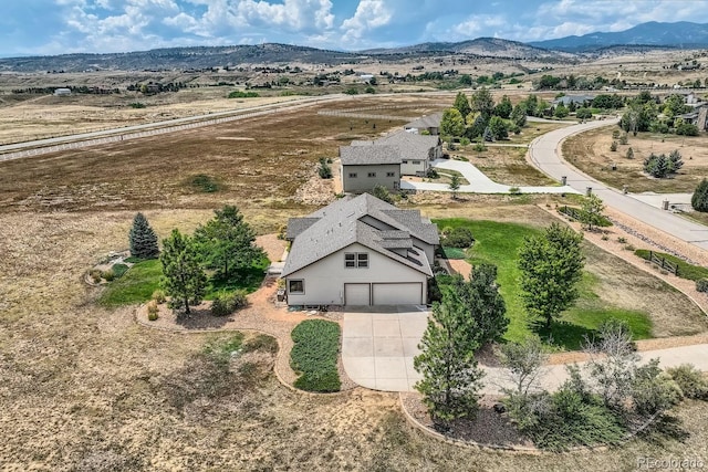 drone / aerial view featuring a mountain view