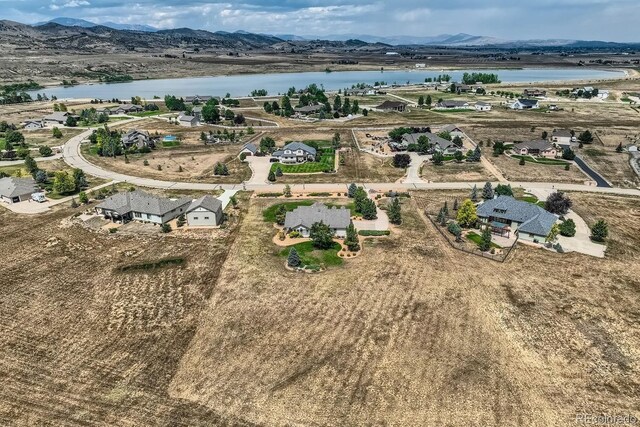 bird's eye view featuring a water and mountain view