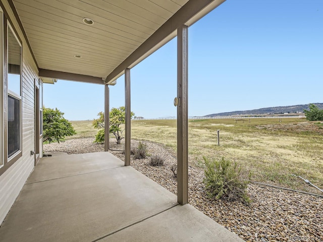 view of patio / terrace featuring a rural view