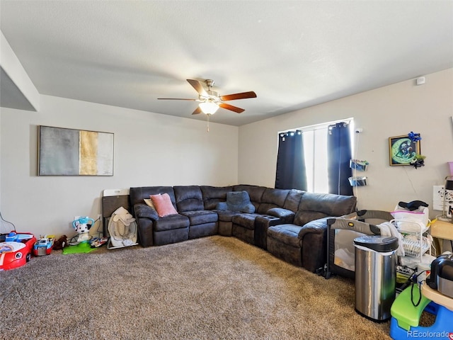 carpeted living room with a ceiling fan