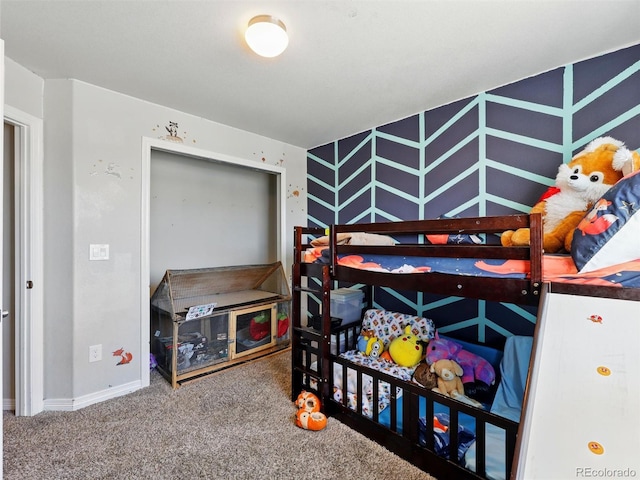 bedroom with carpet and baseboards