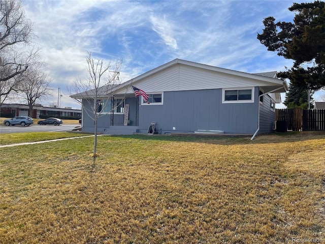 exterior space with a front lawn and fence