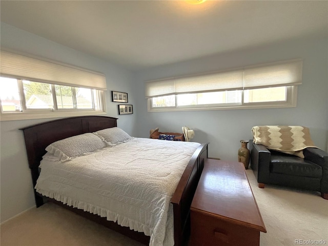 bedroom with light carpet and vaulted ceiling