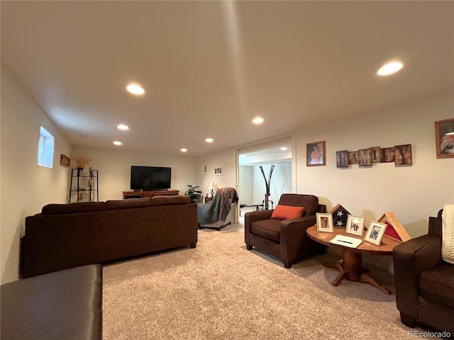 carpeted living area with recessed lighting