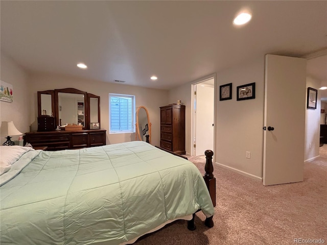 bedroom featuring recessed lighting, light colored carpet, baseboards, and visible vents