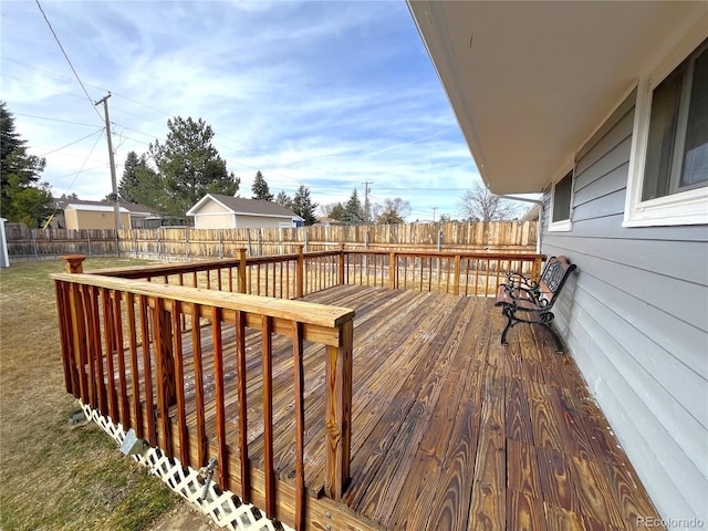 deck with a yard and a fenced backyard