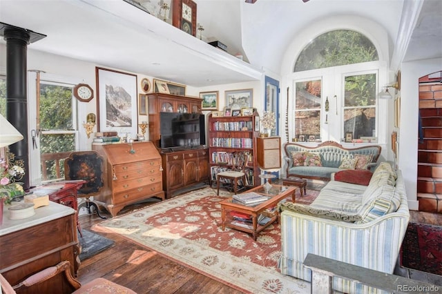 living area featuring a high ceiling and wood finished floors