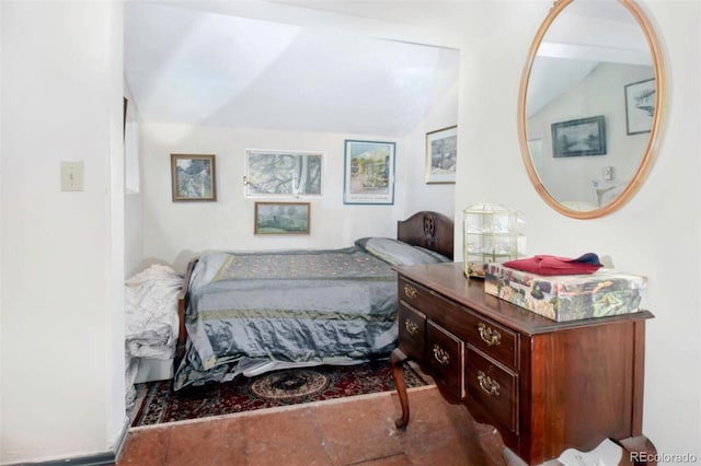 bedroom featuring vaulted ceiling