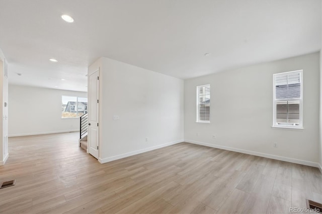 unfurnished room with light hardwood / wood-style floors