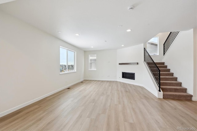 unfurnished living room featuring light hardwood / wood-style floors