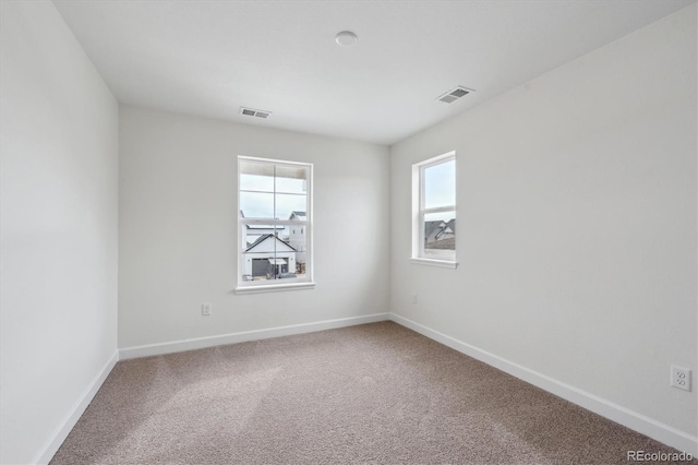 unfurnished room with carpet floors