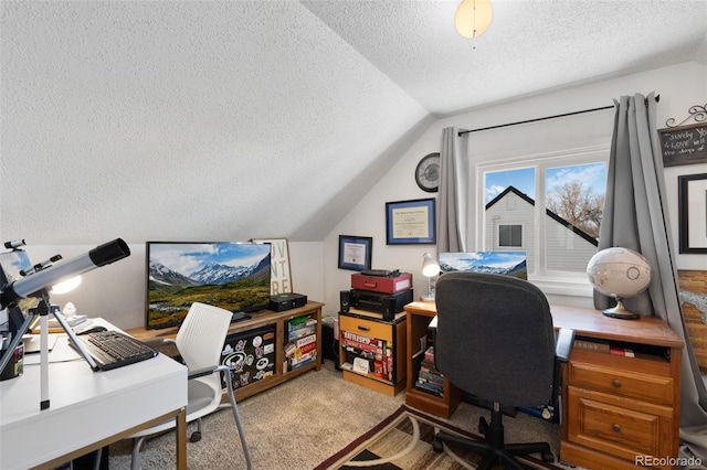 carpeted office space with a textured ceiling and vaulted ceiling