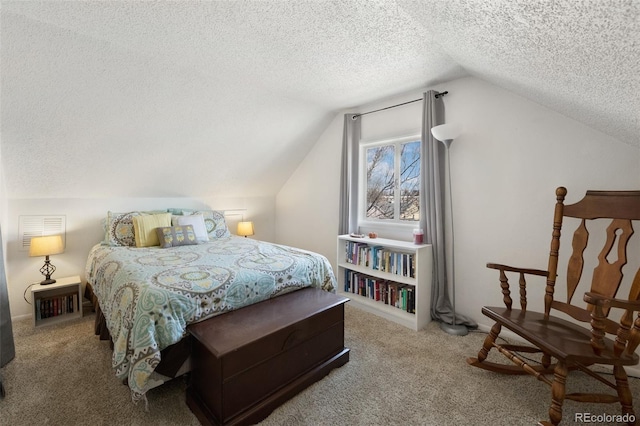 bedroom with lofted ceiling, carpet floors, and a textured ceiling