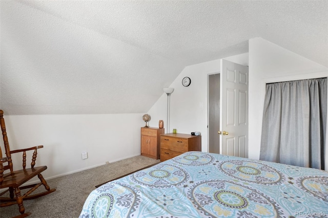 bedroom with a textured ceiling, vaulted ceiling, baseboards, and light carpet