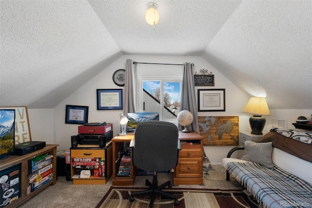 carpeted office with vaulted ceiling and a textured ceiling