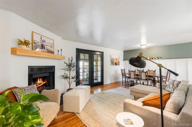 living room with hardwood / wood-style flooring and french doors