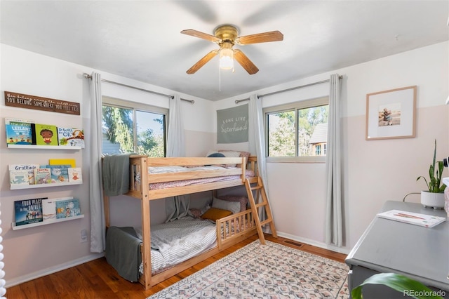 bedroom featuring hardwood / wood-style flooring and ceiling fan