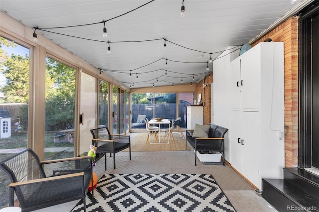 sunroom / solarium with track lighting