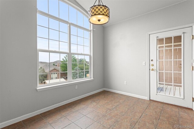 7440 S Blackhawk St Unit 207, Englewood, CO 80112 - spare room featuring baseboards