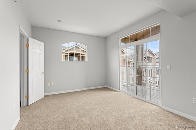 7440 S Blackhawk St Unit 207, Englewood, CO 80112 - carpeted empty room with baseboards and a smoke detector