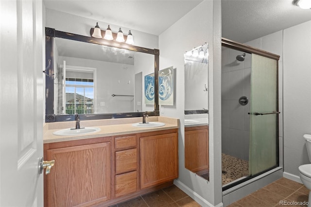7440 S Blackhawk St Unit 207, Englewood, CO 80112 - full bath featuring double vanity, a shower stall, and tile patterned floors