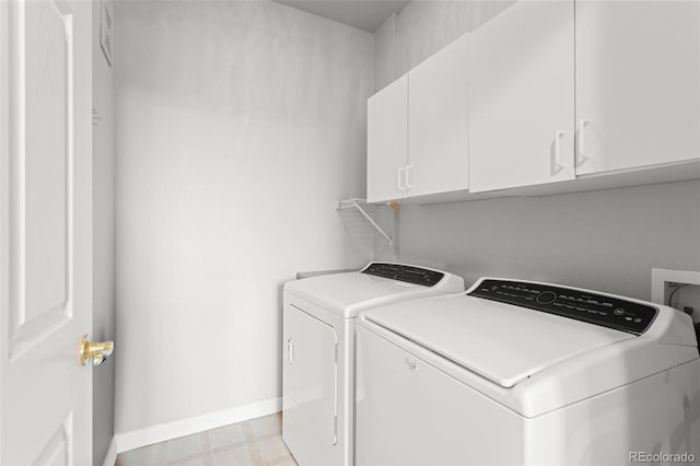 7440 S Blackhawk St Unit 207, Englewood, CO 80112 - washroom featuring separate washer and dryer, cabinet space, and light floors