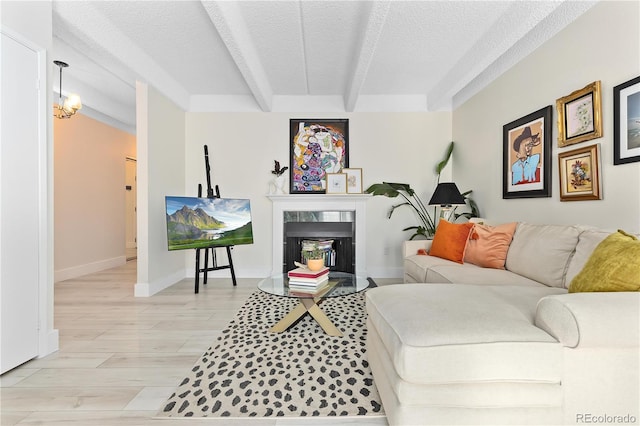 living room featuring beam ceiling, a premium fireplace, a textured ceiling, and light hardwood / wood-style floors