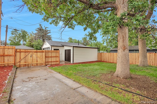 1325 Dayton St, Aurora, CO 80010 - fenced yard featuring a gate and an outdoor structure
