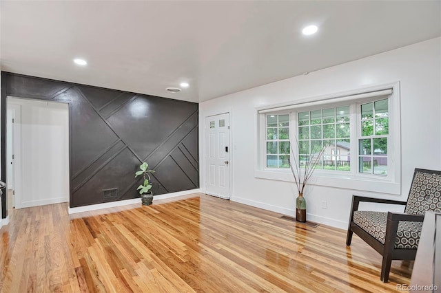 1325 Dayton St, Aurora, CO 80010 - entrance foyer with light wood-style flooring, recessed lighting, and a decorative wall