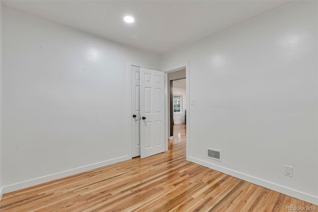 1325 Dayton St, Aurora, CO 80010 - empty room featuring light wood finished floors and recessed lighting