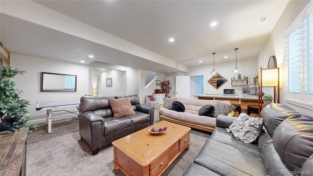 living room featuring sink and light carpet