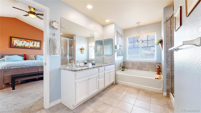 bathroom featuring tile patterned flooring, vanity, ceiling fan with notable chandelier, vaulted ceiling, and shower with separate bathtub