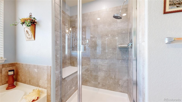 bathroom with independent shower and bath