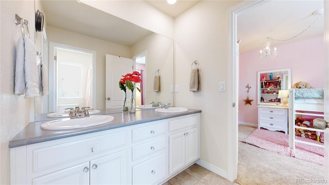 bathroom with vanity, tile patterned floors, and an inviting chandelier