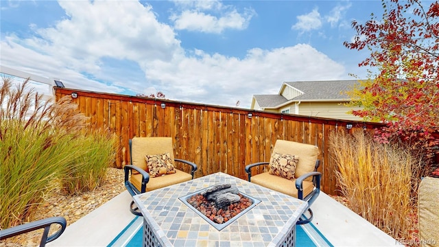 view of patio featuring a fire pit