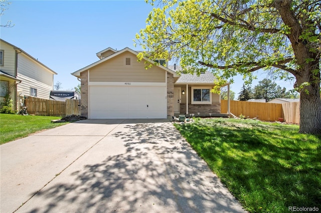 ranch-style home with fence, an attached garage, a front lawn, brick siding, and driveway