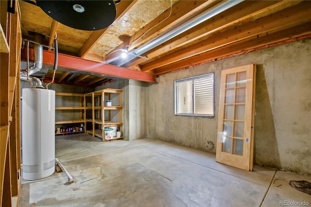 below grade area featuring water heater