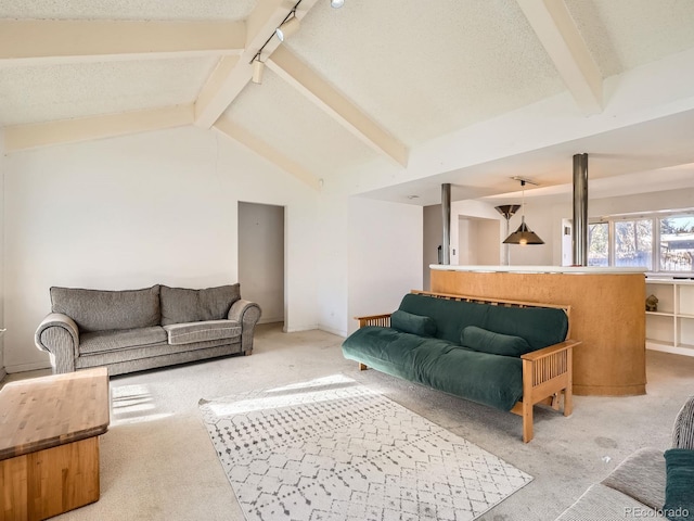 living room with a textured ceiling, vaulted ceiling with beams, and light carpet