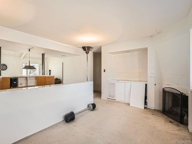 living room featuring a fireplace and carpet floors