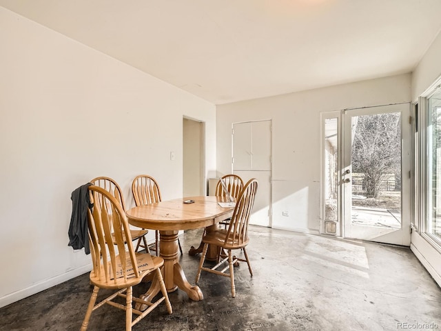 dining room featuring concrete flooring