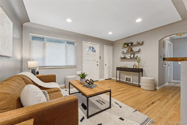 living room with light hardwood / wood-style flooring