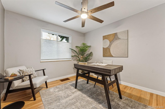 office space featuring light hardwood / wood-style floors and ceiling fan