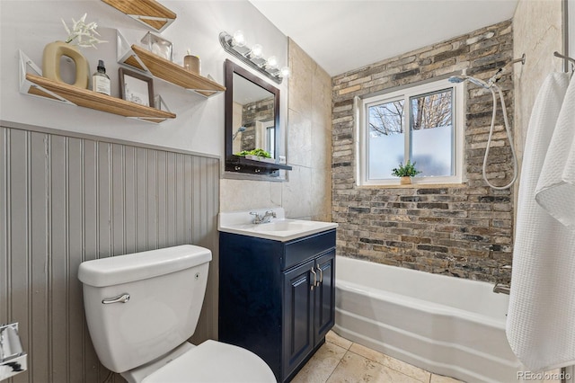 full bathroom featuring vanity, shower / bath combo with shower curtain, tile patterned flooring, toilet, and wood walls