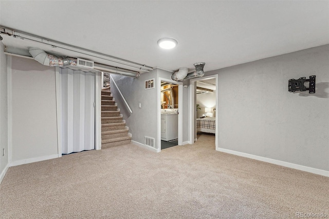 basement with carpet flooring and washer / clothes dryer