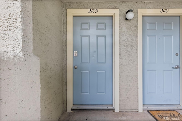 20 S Boulder Cir Unit 2109, Boulder, CO 80303 - doorway to property featuring stucco siding