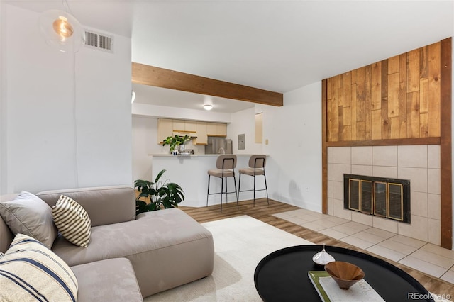 20 S Boulder Cir Unit 2109, Boulder, CO 80303 - living area featuring wood finished floors, beamed ceiling, and a fireplace